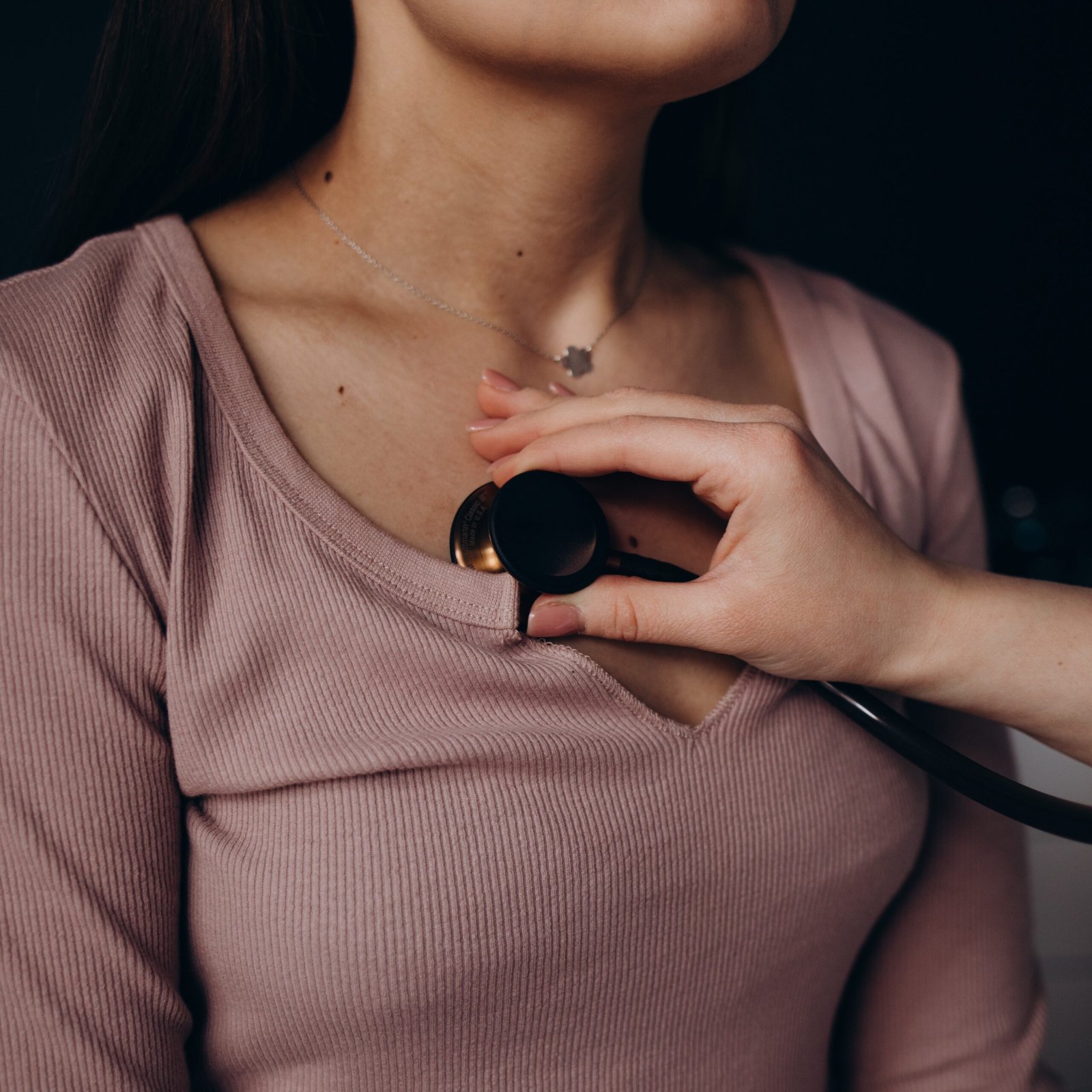 cropped doctor listening stethoscope with to heart of youn 2025 04 01 22 38 00 utc scaled