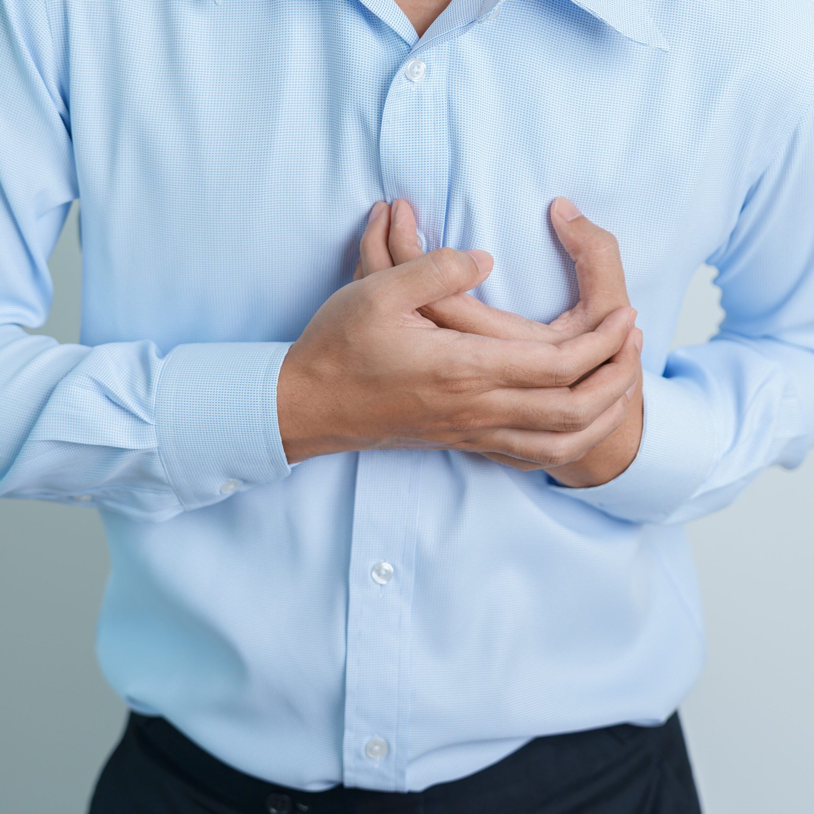 cropped man hand holding chest ache heart disease 2025 03 09 21 10 32 utc scaled